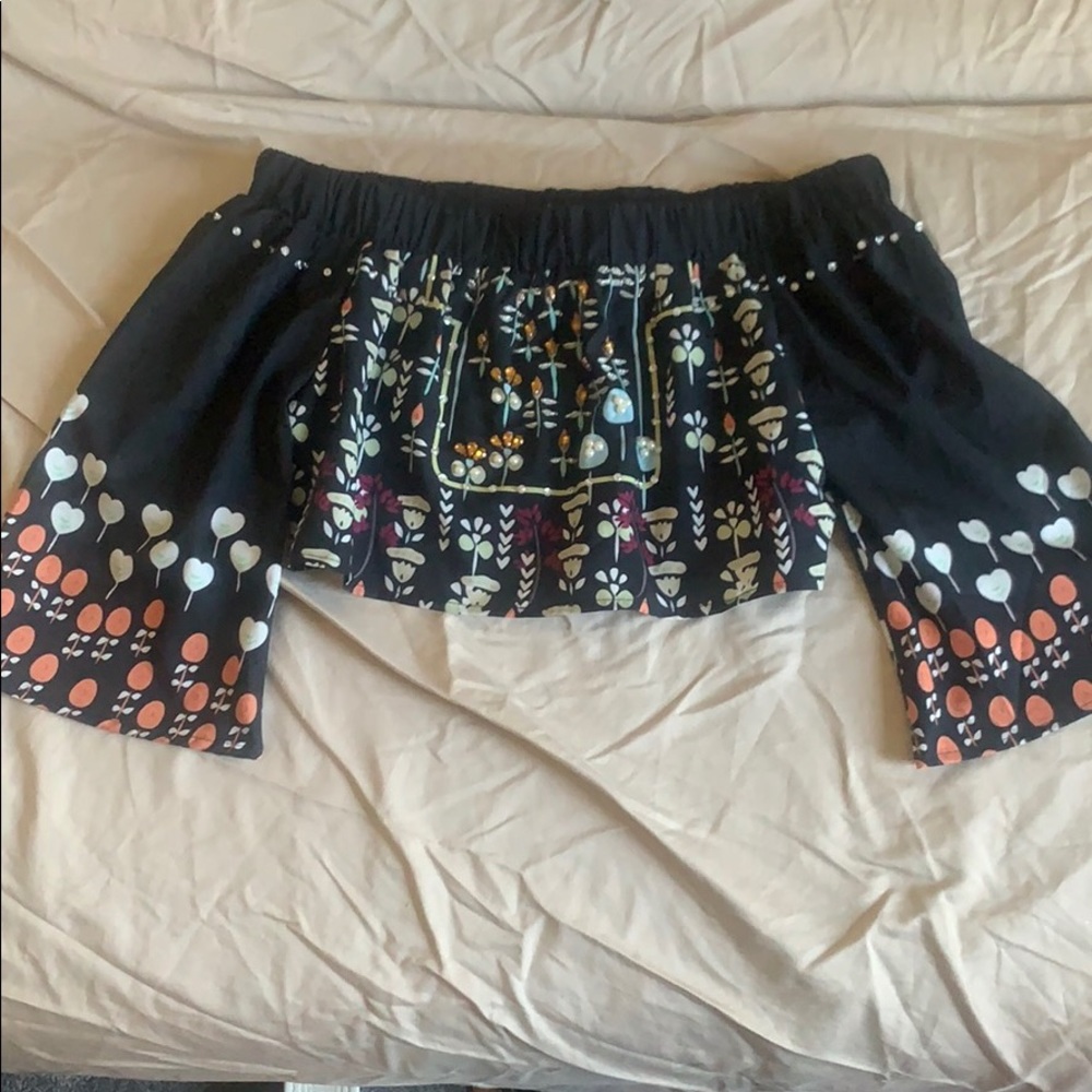 Headed off the shoulder crop top.